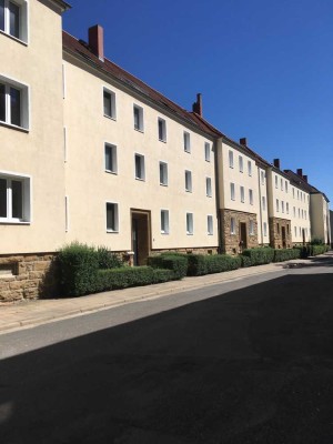 Zweiraumwohnung mit sichtbaren Holzbalken