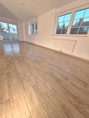 Erstbezug: Stilvolle 2-Zimmer-Wohnung, lichtdurchflutet, zeitlos und naturnah in Maintal-Dörnigheim.