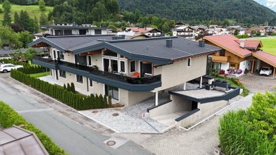 Exklusives Wohnen in Ruhelage – Neubau mit nur vier Wohneinheiten in Kössen, Top 2 im Erdgeschoss