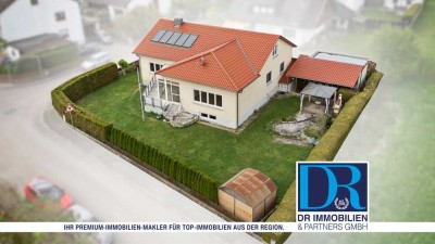 Einfamilienhaus auf großem Eckgrundstück mit Wintergarten und Garage
