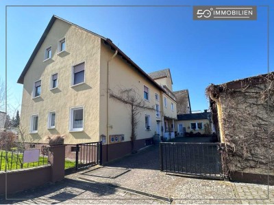 Gepflegtes Mehrfamilienhaus mit Gewerbeeinheit und viel Staufläche in begehrter Lage