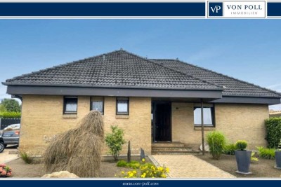 Ein lichterfüllter Bungalow mit Kamin und großem Garten wartet auf Sie