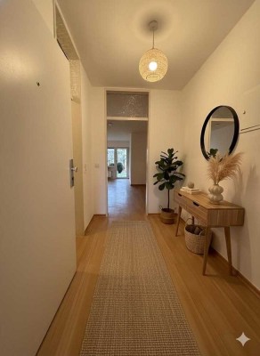 3-Zimmer-Wohnung mit Terrasse, kleinem Garten und offenem Wohn-Essbereich im Untergeschoss