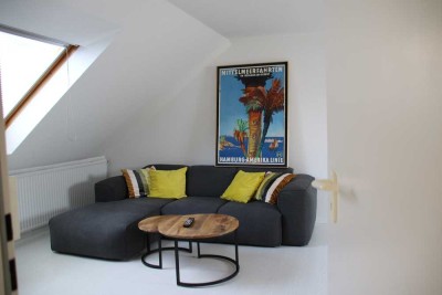 Hochwertig möblierte Dachgeschosswohnung mit Gartenblick – 2-Zimmer