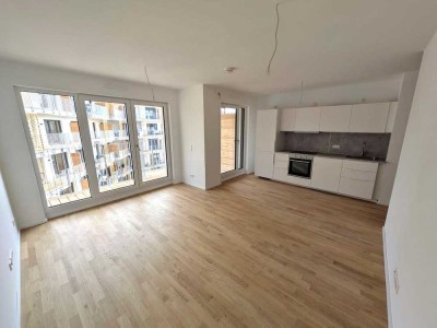 Stilvolle 1-Zimmer-Neubauwohnung mit Süd-Balkon & Tiefgaragenstellplatz – Erstbezug in Toplage