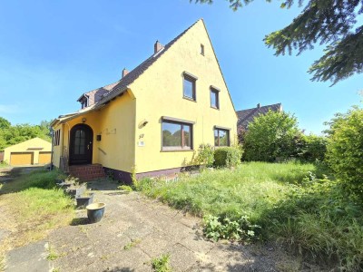 ! Zwei­familienhaus mit großem Grundstück in Bestlage von Ritterhude-Ihlpohl zu verkaufen !