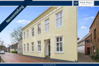 Wohnen mit Geschichte: Denkmalgeschützte Erdgeschosswohnung mit Terrasse & Carport in Weener