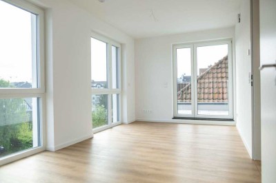 Moderne 2-Zimmerwohnung mit EBK und großer Dachterrasse in zentraler Lage – Erstbezug