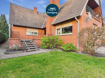 Großzügiges Zweifamilienhaus mit Traumgarten - Freistehend und erstklassig gepflegt!