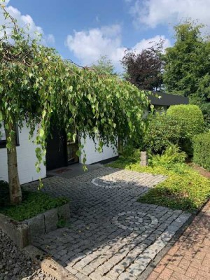 Attraktiver Winkelbungalow auf großzügigem Grundstück in ruhiger Lage mit Abendsonne