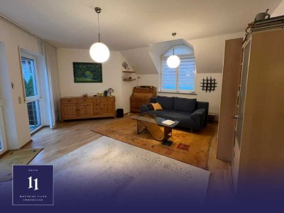 Attraktive Dachgeschosswohnung mit großzügigem Balkon in gepflegter Wohngegend