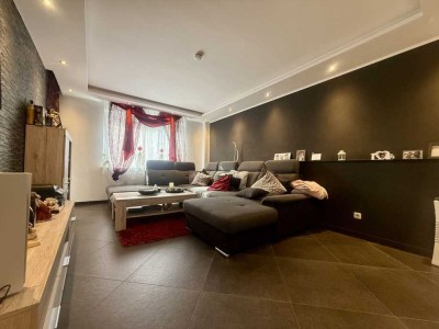Moderne 3-Zimmer-Gartenwohnung mit überdachter Terrasse und Tiefgaragenstellplatz