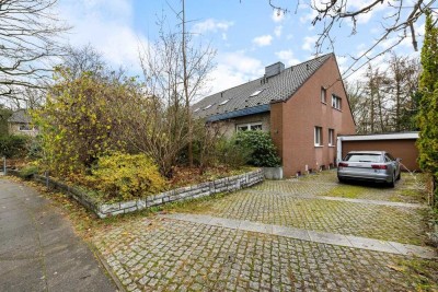 Perfektes Wohnen in Volksdorf:Traumhafte Wohnung im Mehrfamilienhaus mit großem Garten