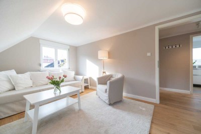 Luxuriöse 2,5-Zimmer DG-Wohnung mit großem Garten in Innenstadtlage