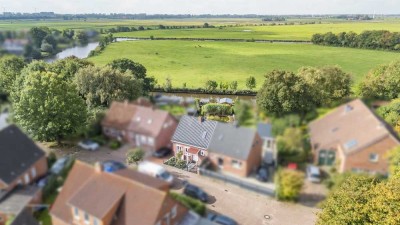 Wasserblick! Gepflegte Doppelhaushälfte mit Traumgarten und Steganlage in Twixlum