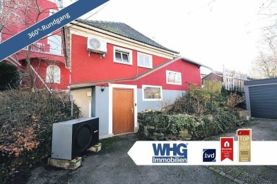 Charmante 2,5-Zimmer-Wohnung mit Wintergarten und Garage