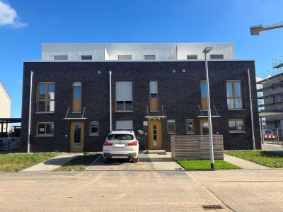 Ihr neues Zuhause: Modernes Mietreihenendhaus mit großzügigem Grundstück