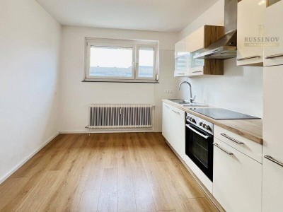 Dachgeschosswohnung mit West-Loggia in zentraler Lage