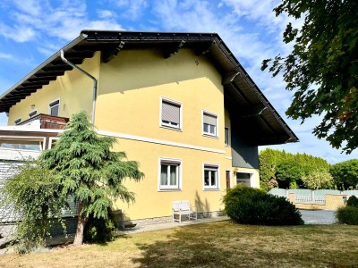 Einzigartiges Zweifamilienhaus mit großem Garten und Doppelgarage!