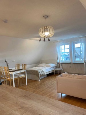 Möbliertes 1,5 Zimmer Appartement mit Stellplatz über den Dächern des historischen Marktplatzes