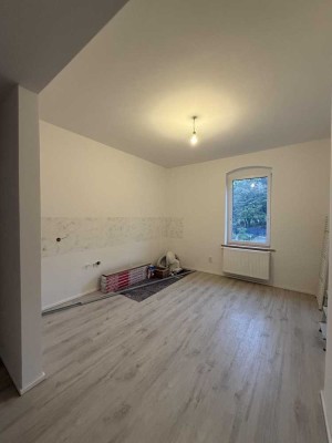 **Erstbezug nach Sanierung! Gemütliche Wohnung mit offener Küche in bester Lage**