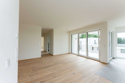 Stilvolle Gartenwohnung mit hochwertiger Ausstattung, eigenem Garten, Einbauküche, Loggia & TG
