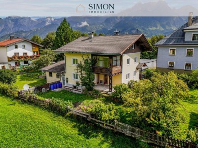 Einfamilienhaus mit Blick ins angrenzende Grünland und auf die Berge – zentrale Lage in Saalfelden