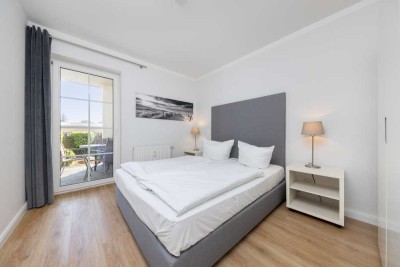 Provisionsfreie, moderne 2-Zimmer Ferienwohnung mit Stellplatz & Sonnenterrasse (150 m zum Strand)