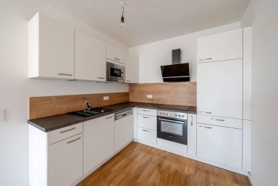 Ihr Rückzugsort im Grünen – 2-Zimmer-Wohnung mit Balkon und Tiefgaragenparkplatz