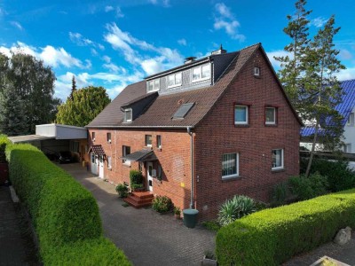 2-Familienhaus mit Einliegerwohnung und 165 m² Gewerbeeinheit. 10 Stellplätze und schöner Garten