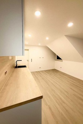 Neuwertige 2-Zimmer-DG Wohnung mit Tiefgaragenstellplatz